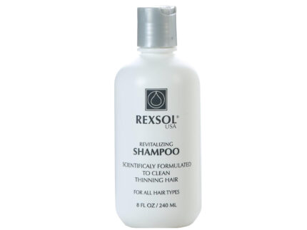 Revitalizing Shampoo A bottle of Rexsol Revitalizing Shampoo with a label indicating its PRO-VITAMIN-ENRICHED formula