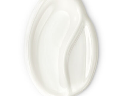Close-up view of Synbionyme PHOTO-3 Invisible Sunscreen SPF50+ texture on a neutral surface.